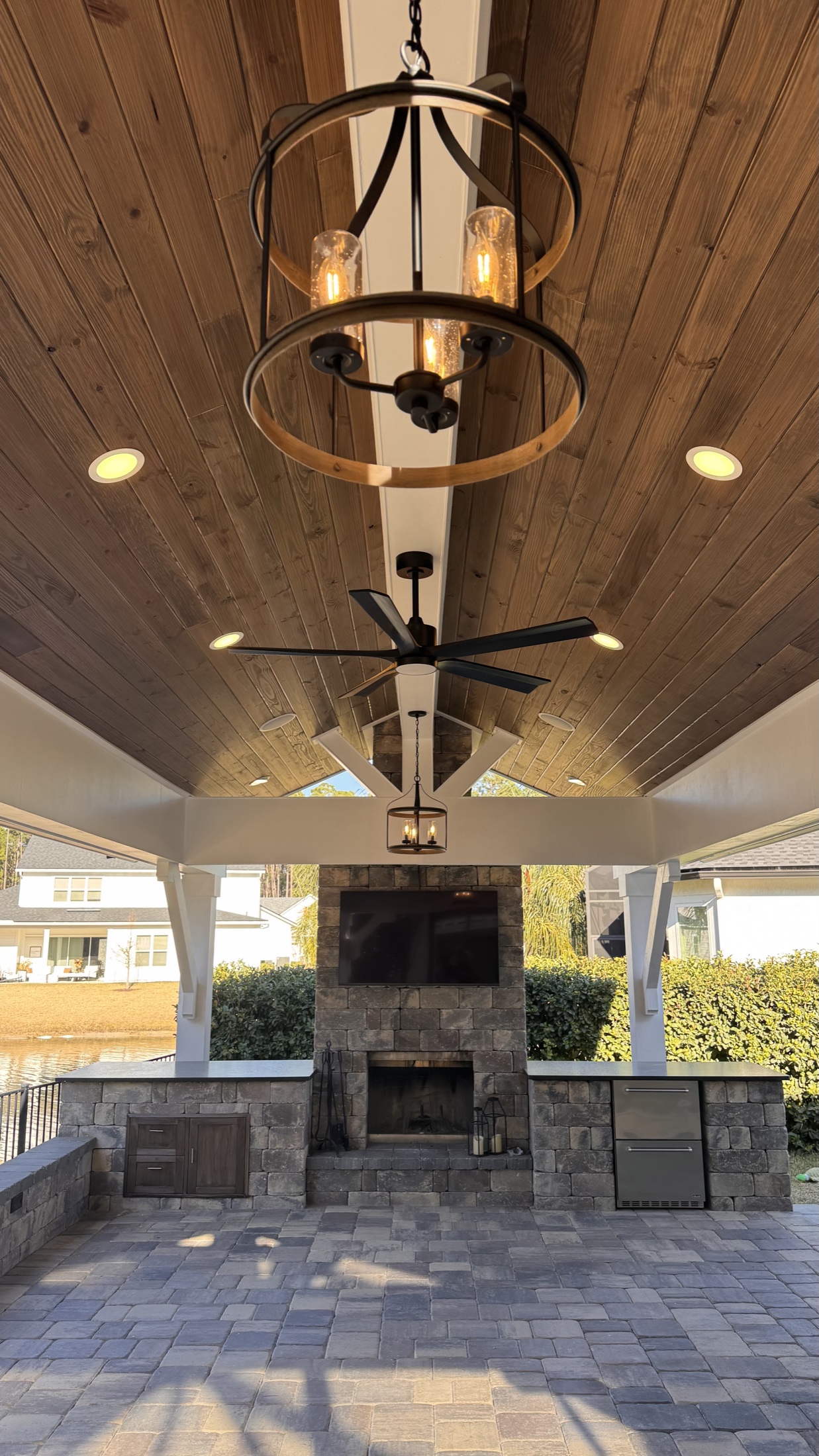 Detail of a completed tongue-and-groove ceiling with lighting and fans
